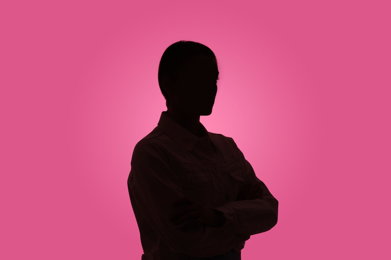 Silhouette of Anonymous Woman on Pink Background